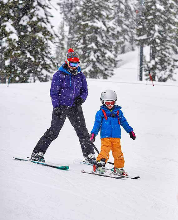 photo of mom and kid skiing